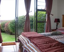 Bedroom leading to garden - Hillcrest Self Catering Apartment