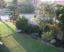 Living-room to patio and garden - Hillcrest Self Catering Apartment